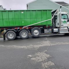 sideview of a dumpster truck.